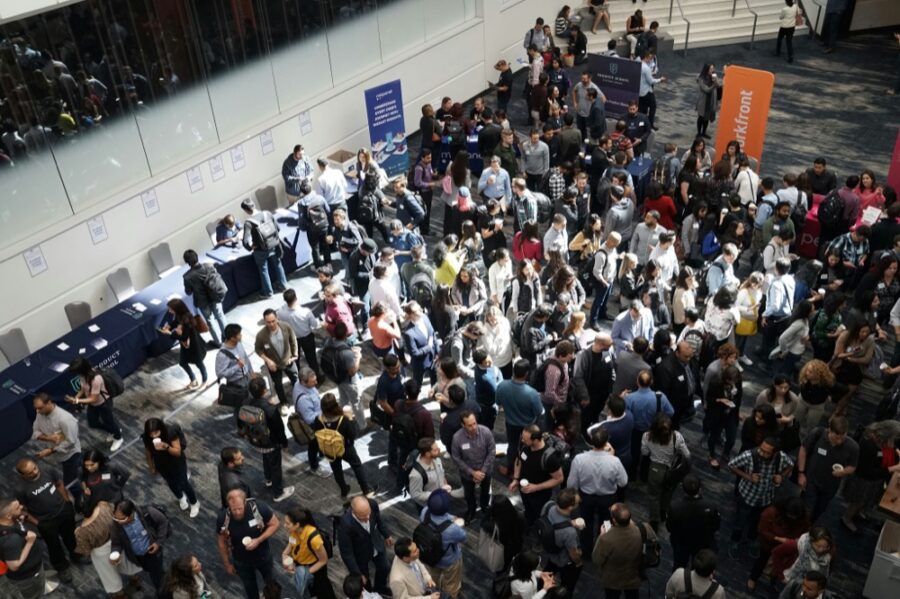 A busy conference hall seen from above